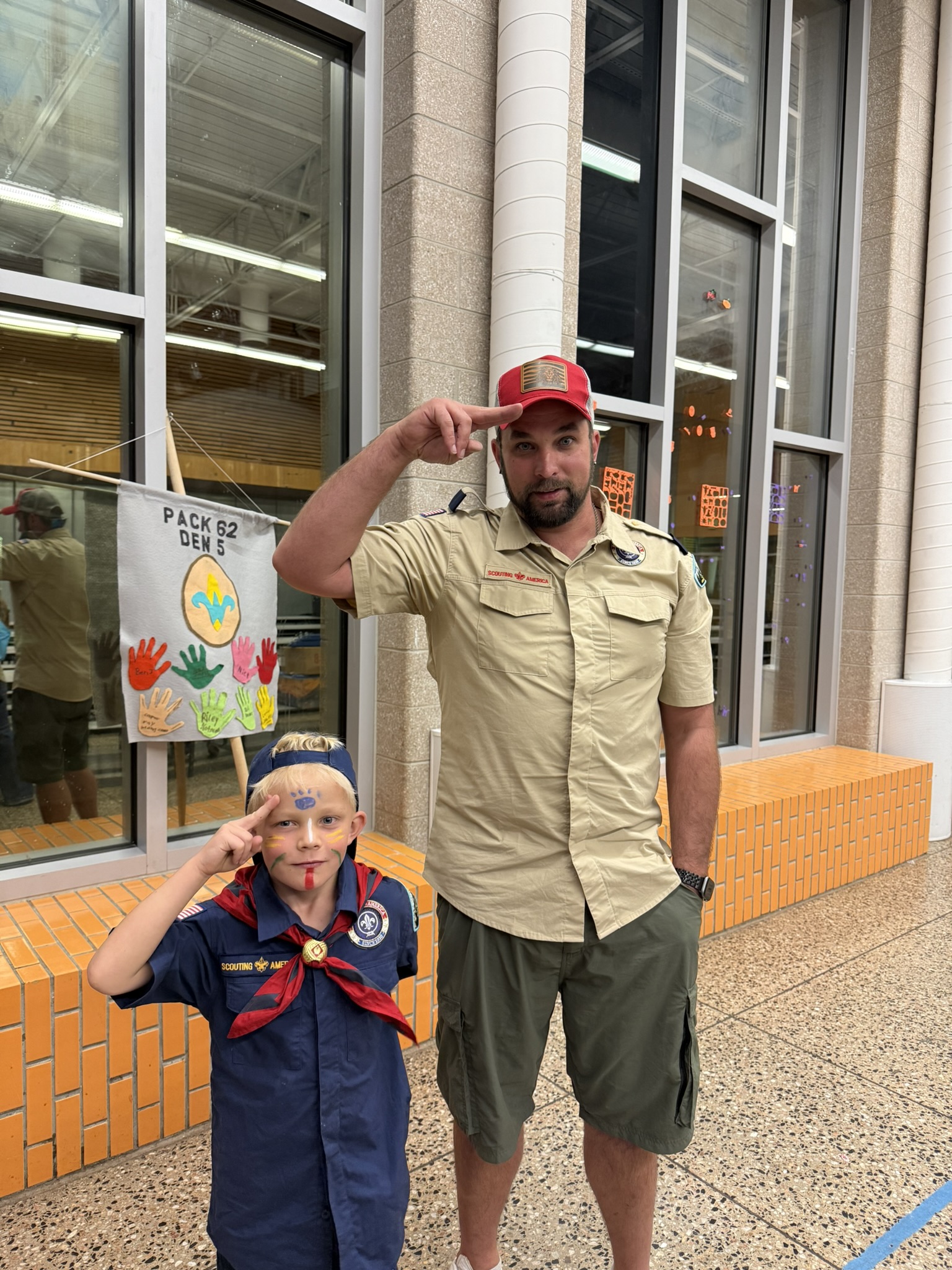 Pack 62 scouts with den banner